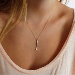Gold plated sterling silver necklace with minimalist charm.